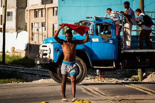 Youth holding Red Vest, Paseo de Marti, Santiago de Cuba